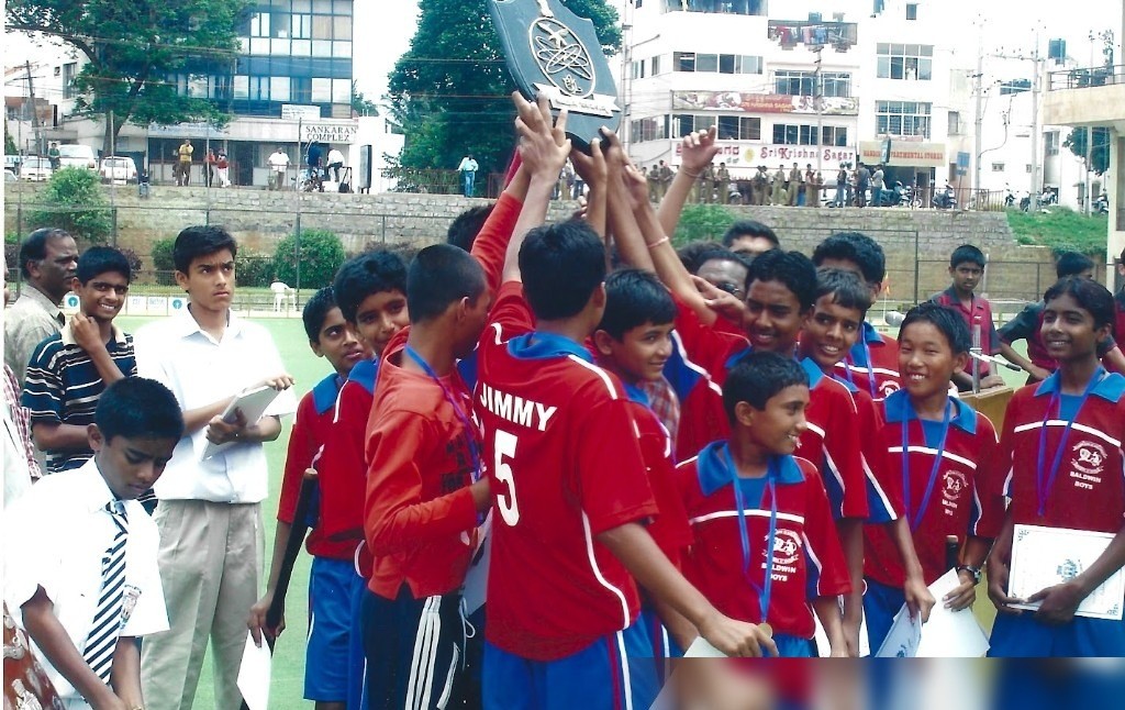 Baldwin Boys hockey team lifting trophy in India Jimmy number 5